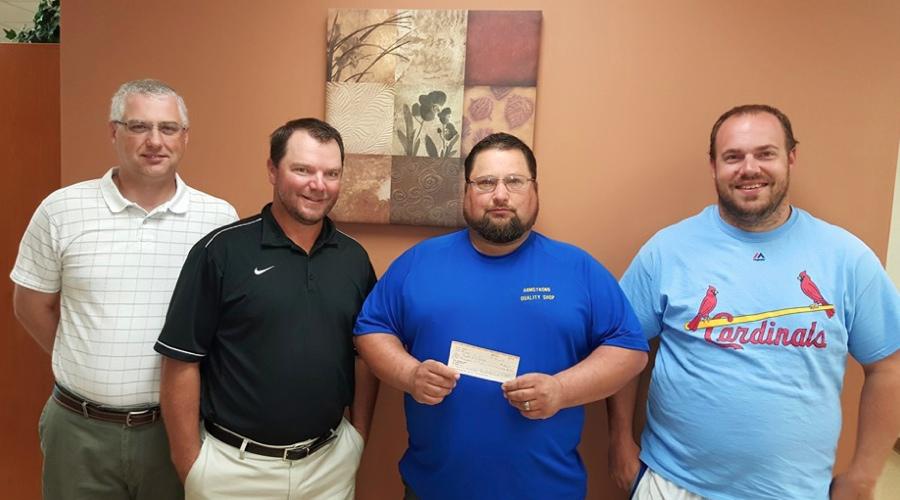 Puxico Athletic Booster Club Presents Check to School