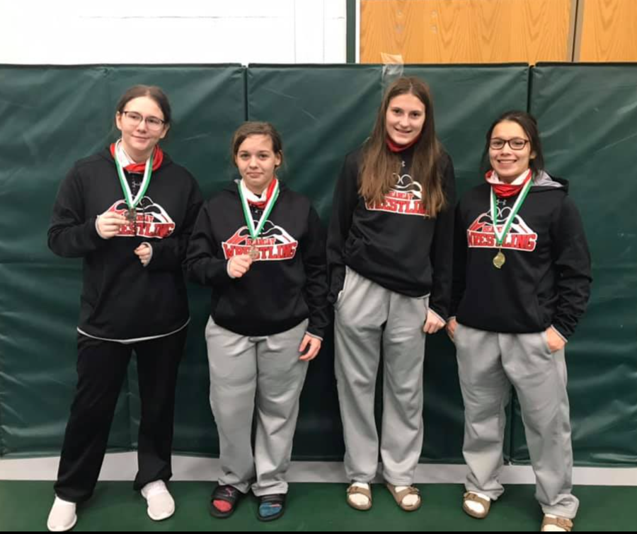 Three Lady Cats Earn Medals in Wrestling